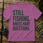 STILL FISHING. KNEES HAVE QUESTIONS. Typography T-Shirt in Berry