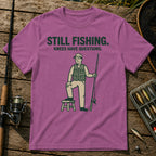 STILL FISHING. KNEES HAVE QUESTIONS. T-Shirt in Berry