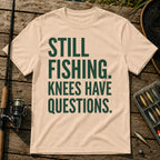 STILL FISHING. KNEES HAVE QUESTIONS. Typography T-Shirt in Cream